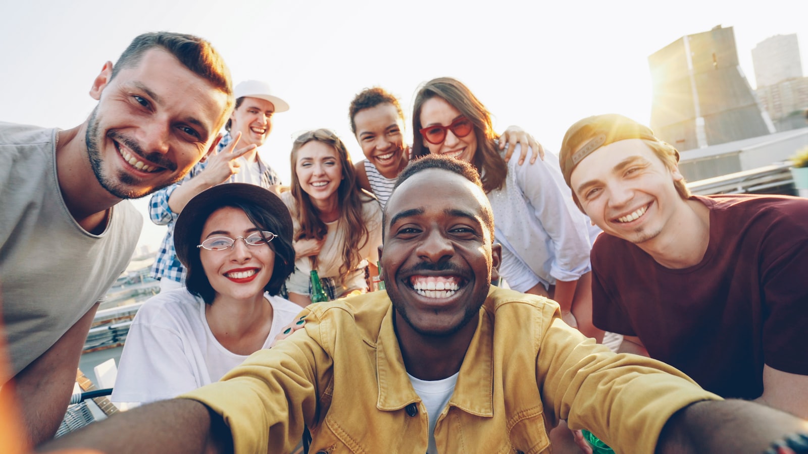 A diverse group of friends together, the kind of trusted circle a savings group is built on